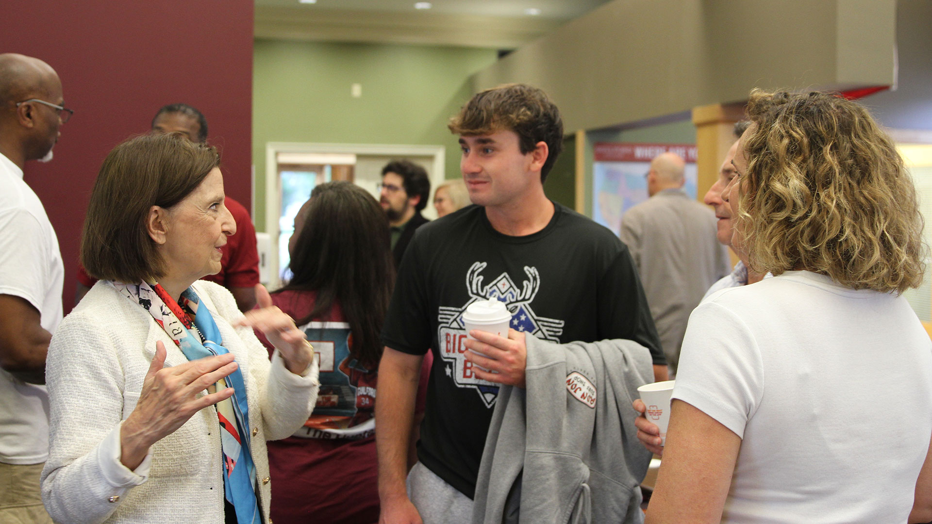 President Jean Bordewich met with Keaton White '29 and other first year students at Saturday's parents recption in Hendricks Hall.