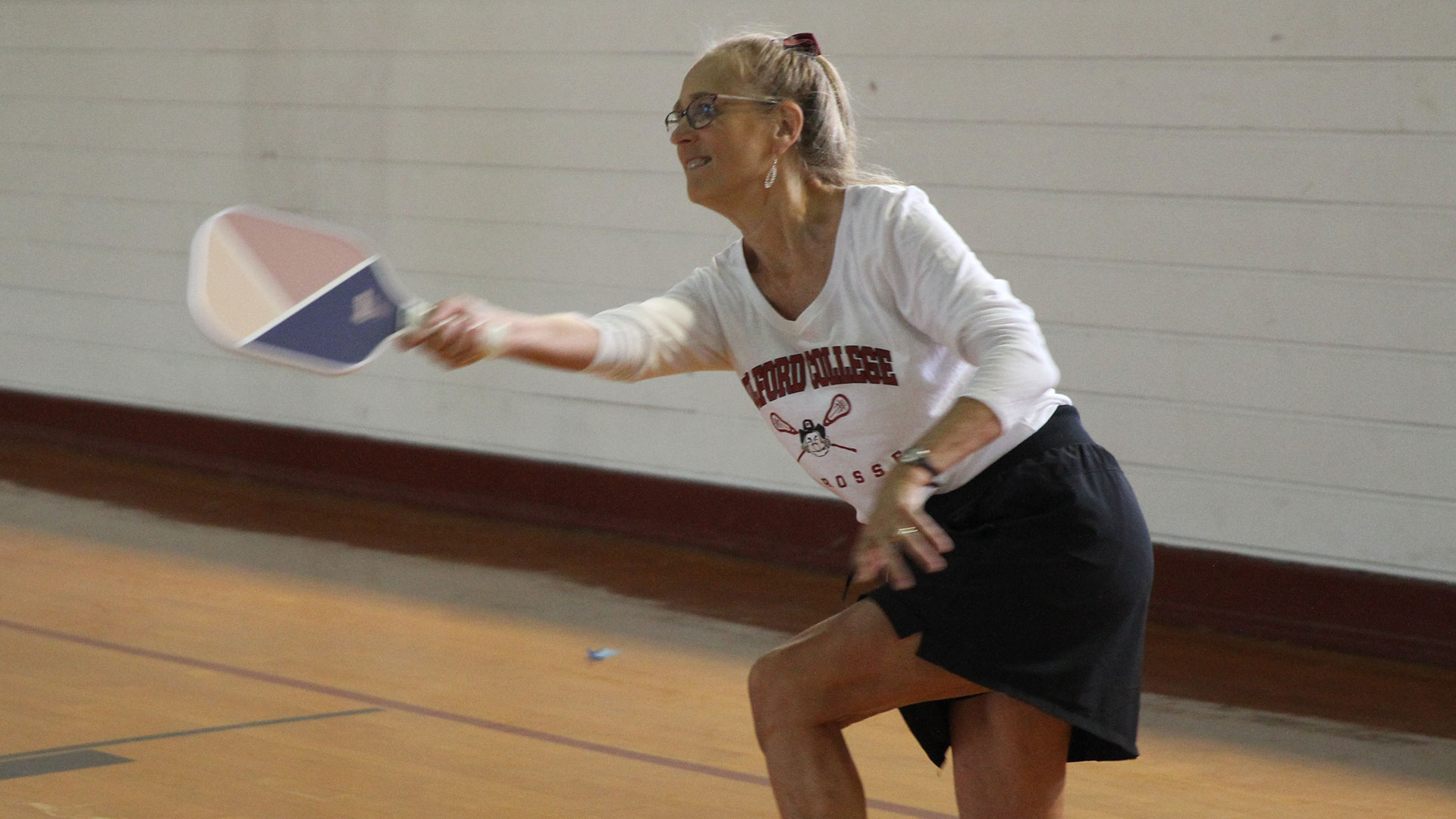 Former lacrosse athlete Rhonna White Phillips '83 tries her hand at pickleball.