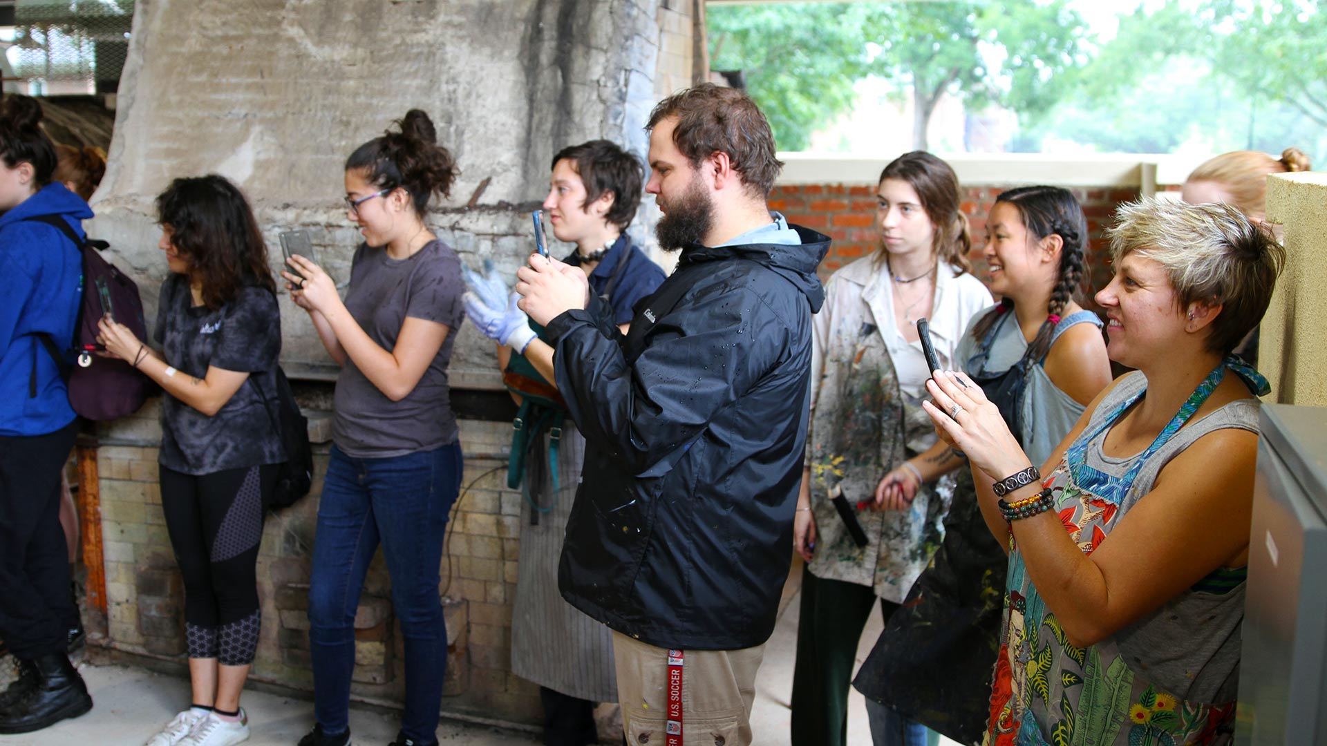 Members of the College community tour the ceramics kiln at Hege-Cox Hall.