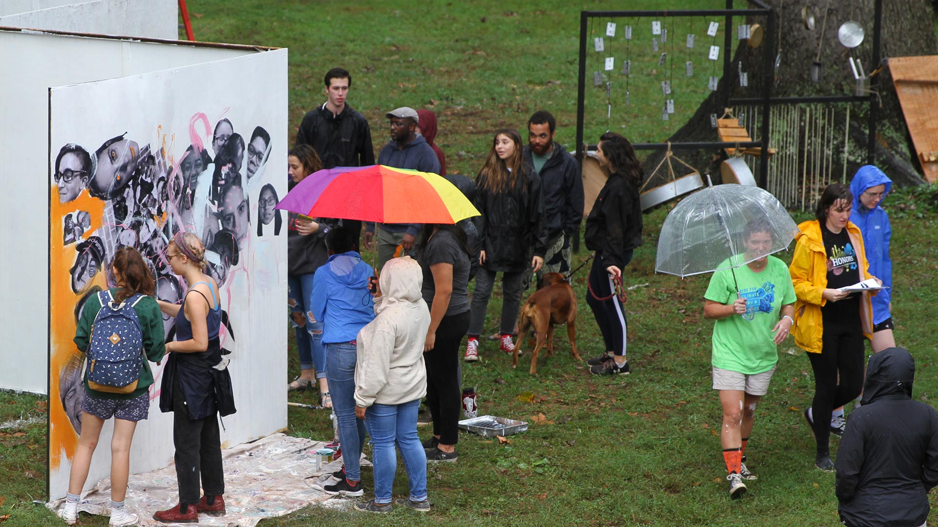 Community members walk in the rain at Meadowfed.