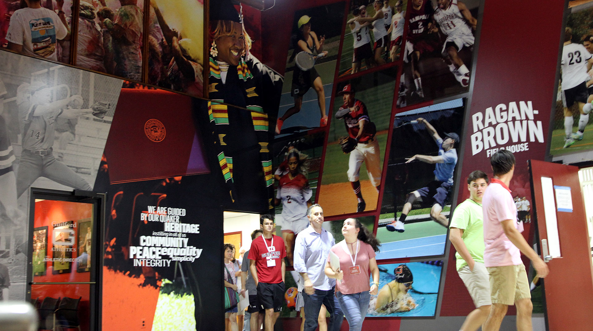 Homecoming attendees tour the new lobby in Ragan Brown. 