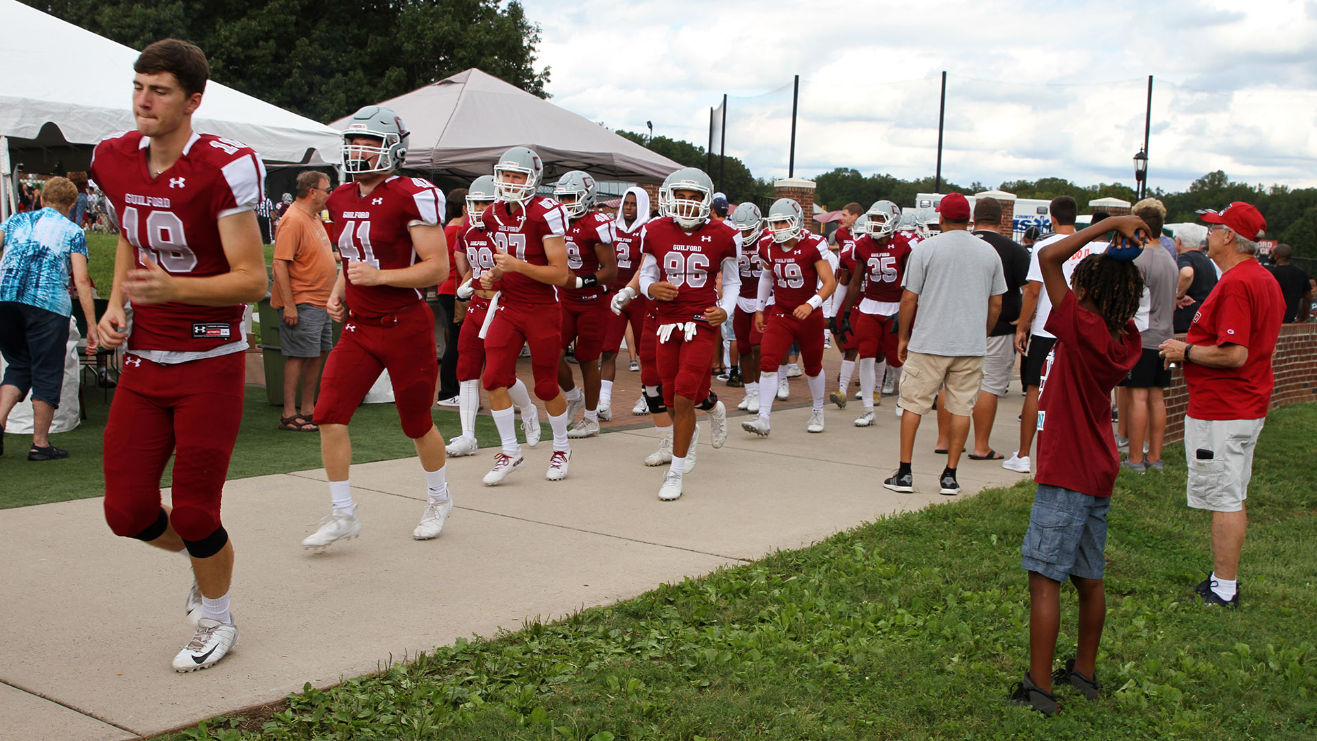 The Guilford College football team takes the field at Homecoming.