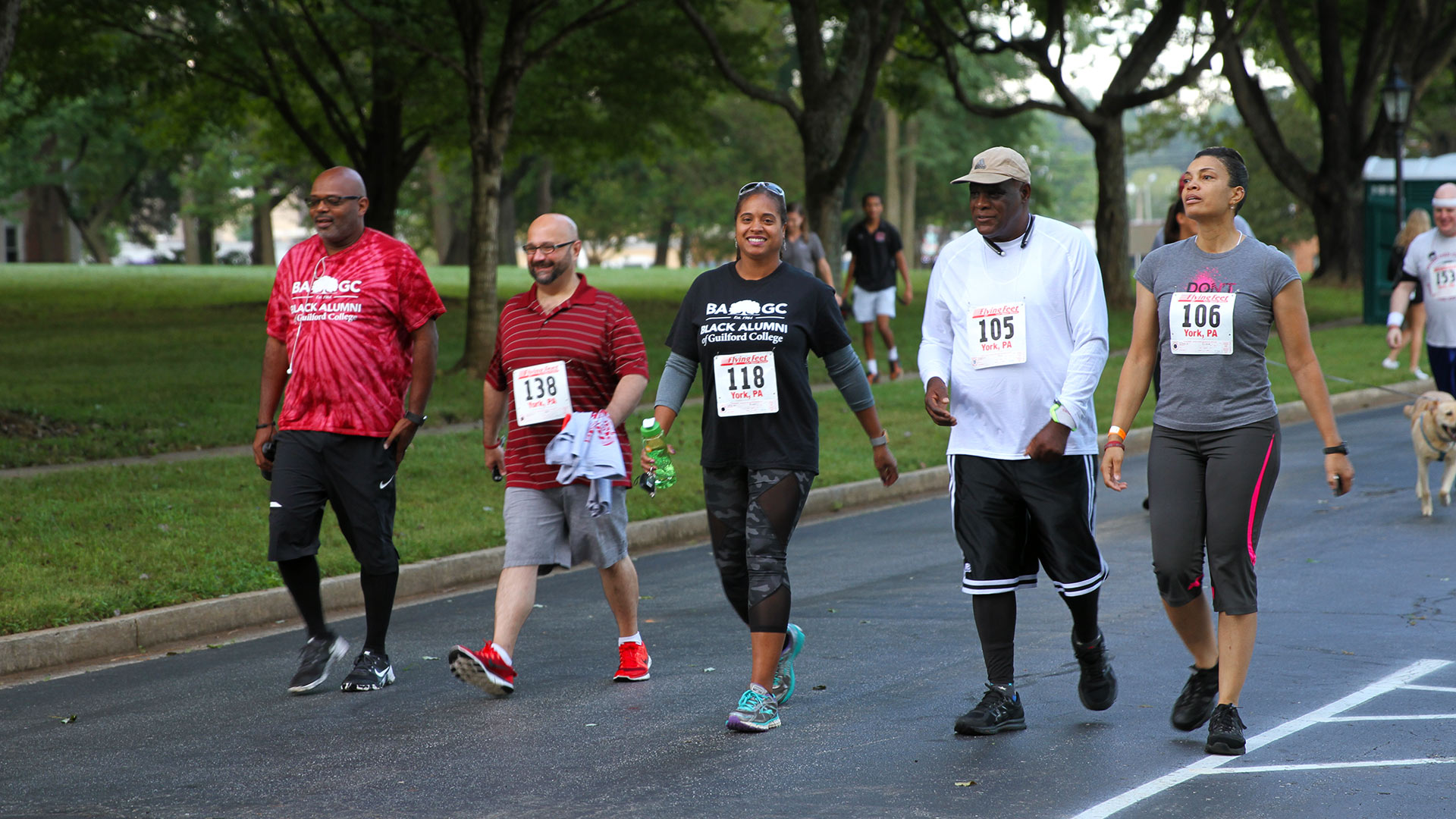 Participants take it easy by walking the Annual Quaker 5K at Homecoming.