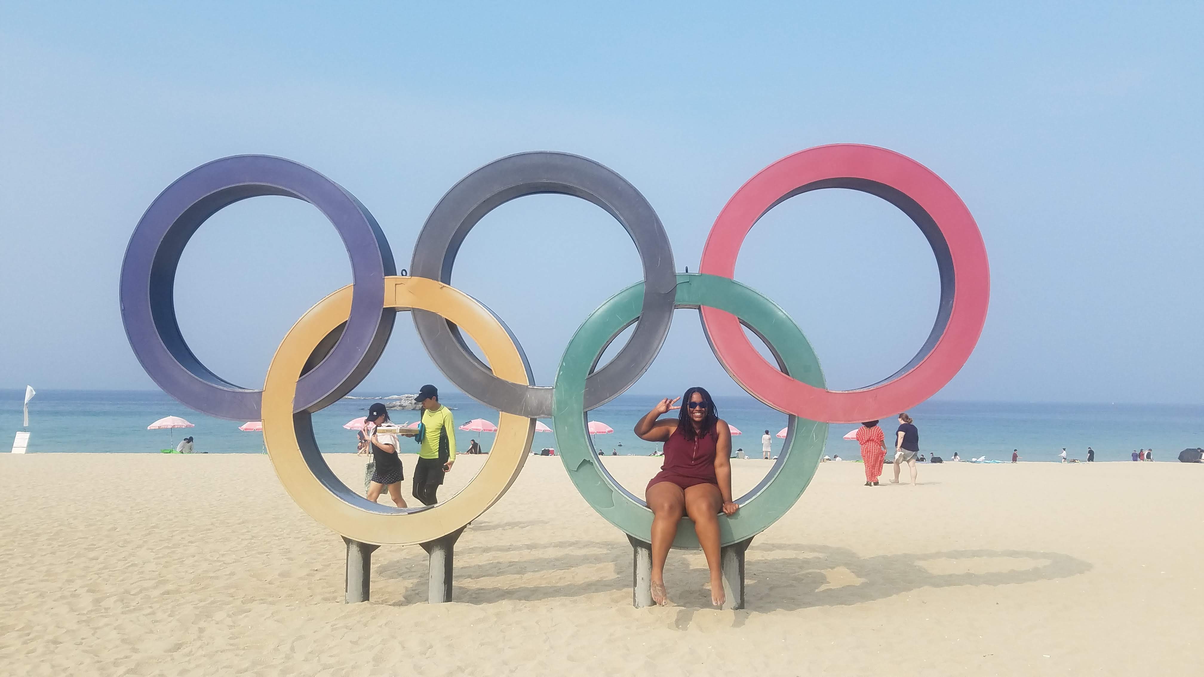 Student Mikayla Jones takes a photo with the Olympic rings in South Korea.