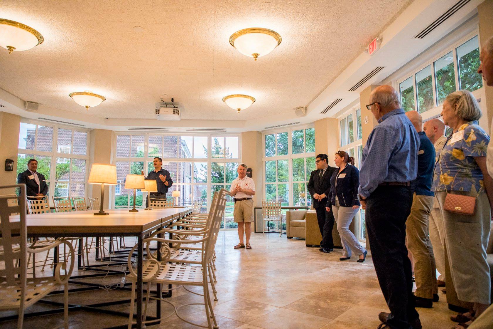 The crowd stands in the Orangerie during a Binford tour.