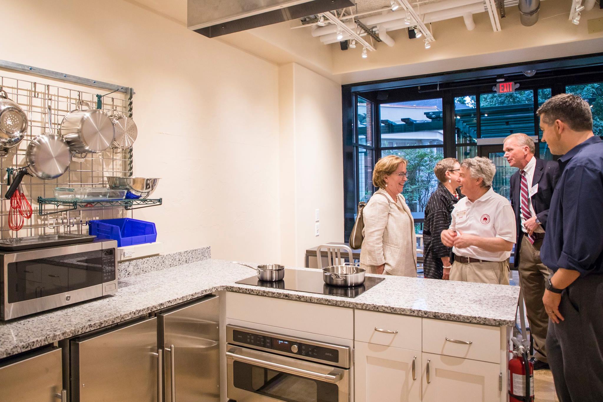 Guests tour the new demonstration kitchen in Binford Hall.