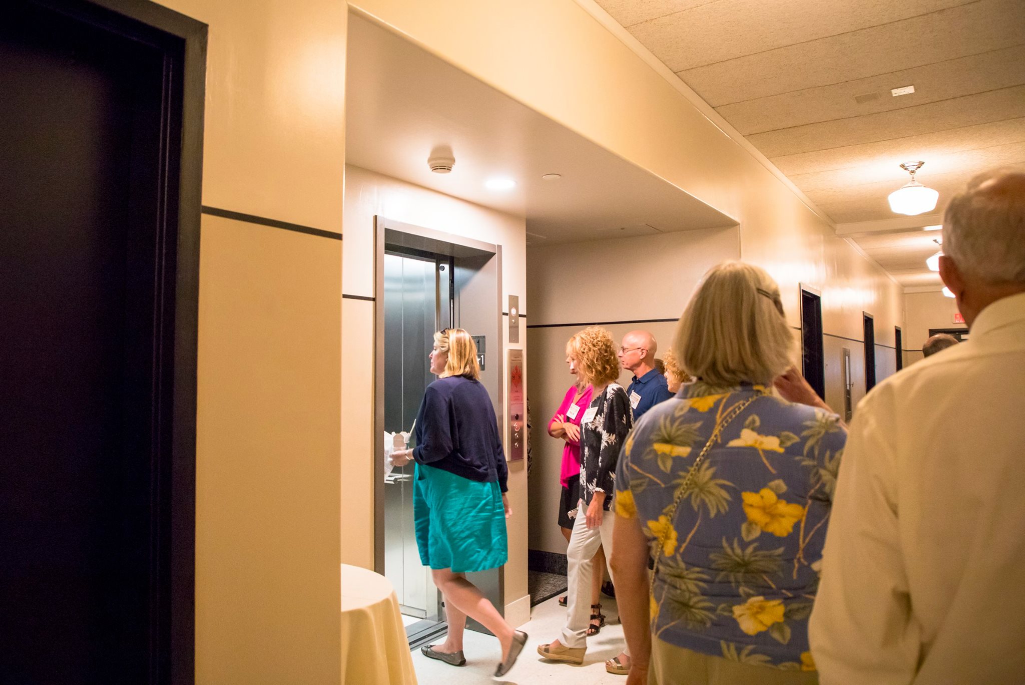 Guests take turns using the new elevator in Binford Hall.