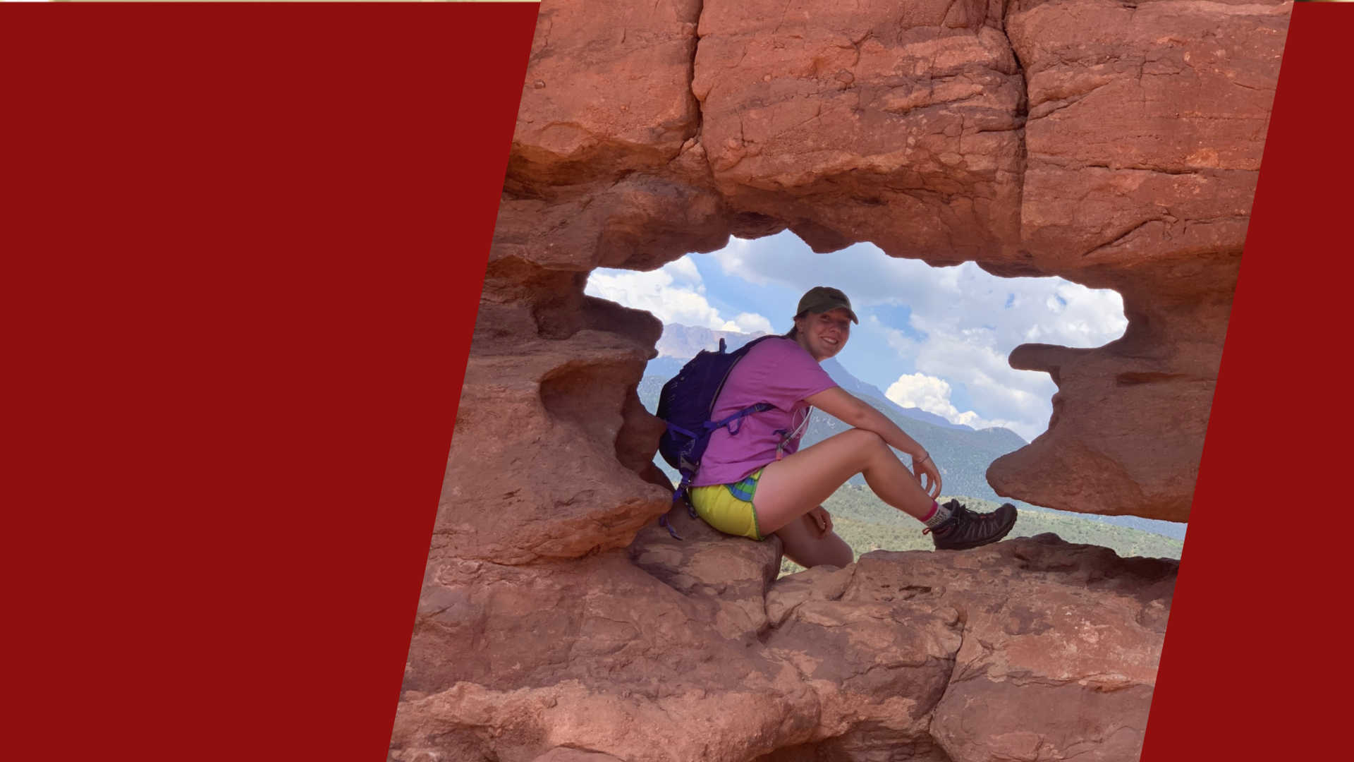 Kathleen Caspersen '20 poses while hiking among red rocks.