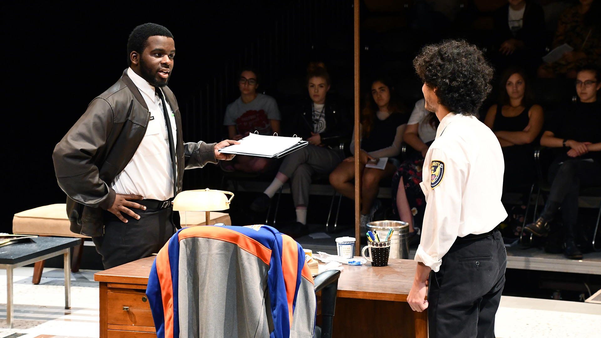 Students perform in a scene from Lobby hero.