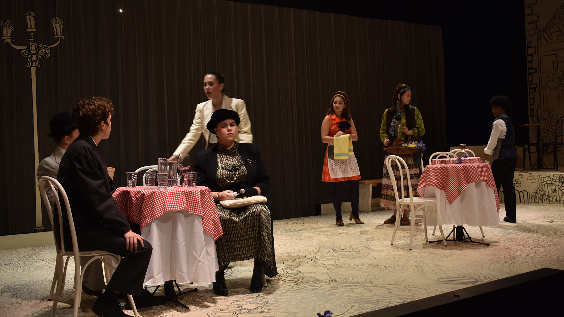 Students perform in the Mad Woman of Chaillot.