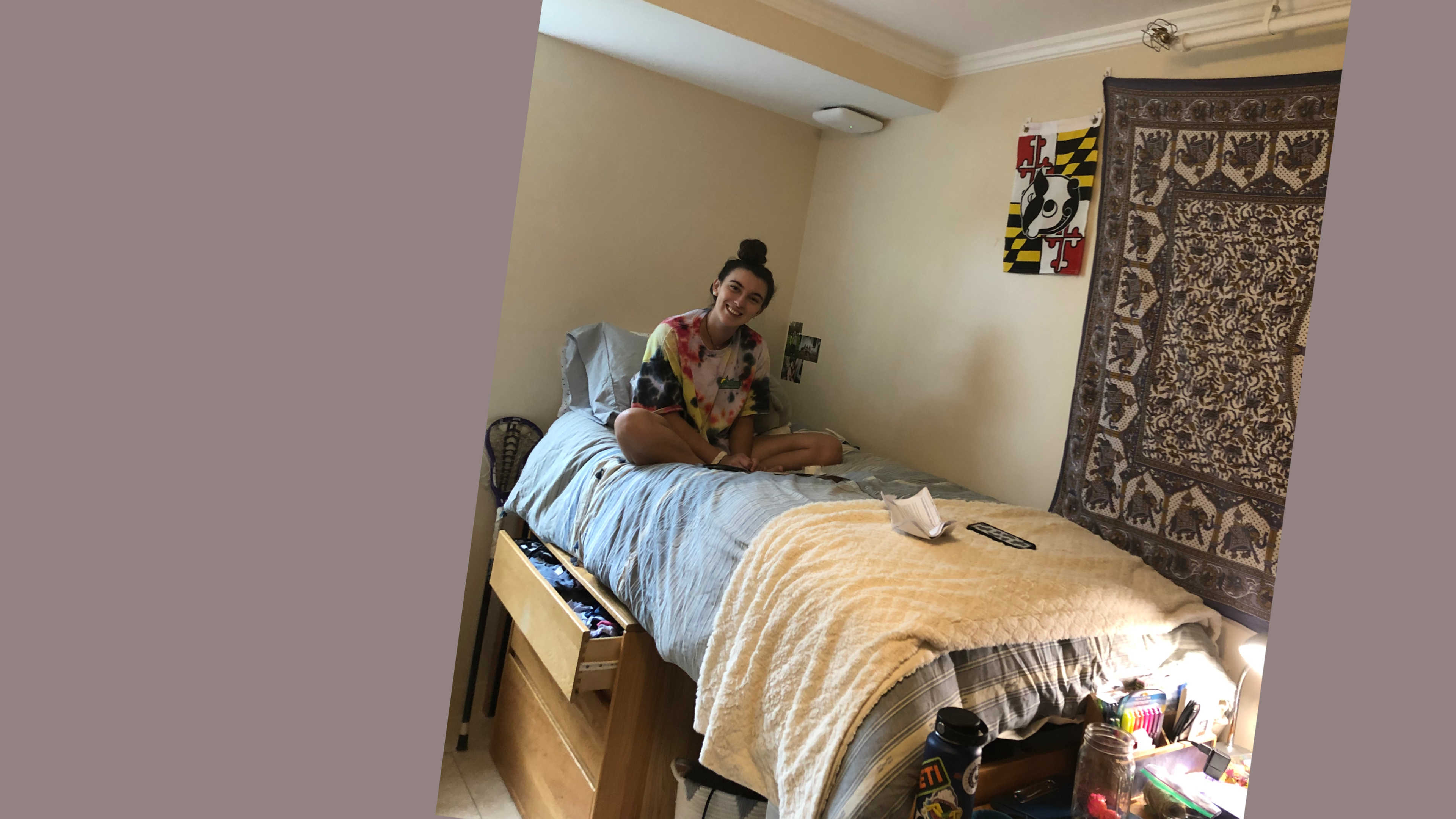This student is all moved in and ready to relax on her new bed after an exciting day.