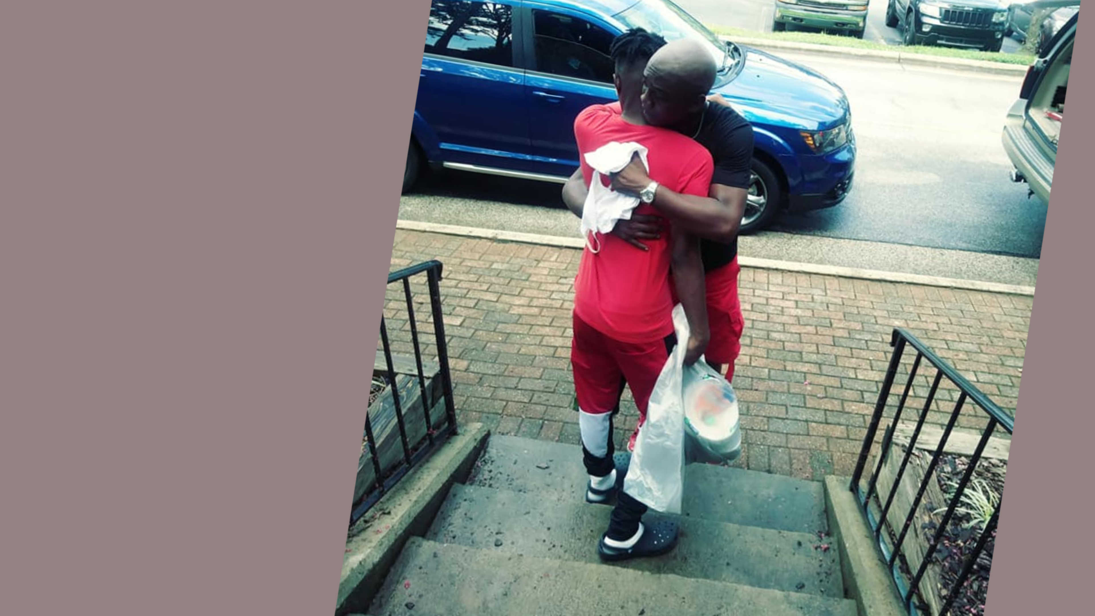 A family member shares a big hug and a few tears as they hug their student before leaving.