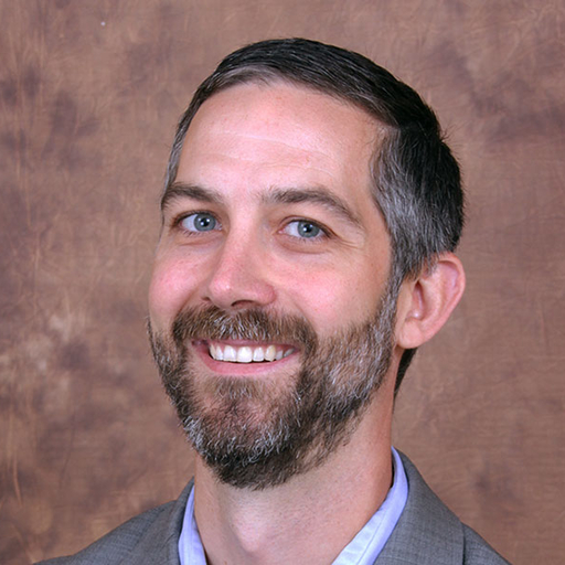 Styeve Mencarini in a gray suit
