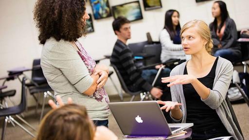 A student asks the professor a question in an English and Creative Writing class.