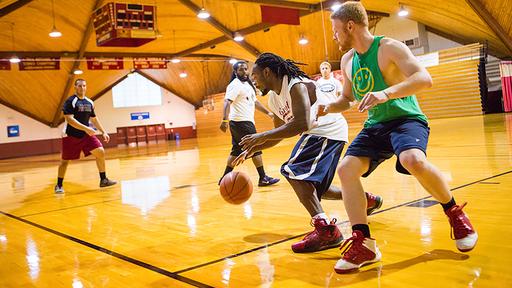 Guilford College students play intramural basketball. 