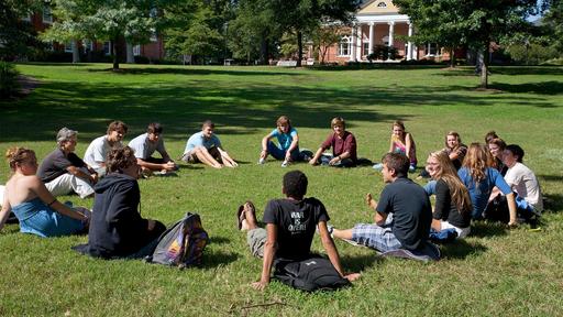 Students sit in a circle in class on the Quad.