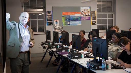 Business Professor Darryl Samsell teaches a finance class in Bauman Hall.