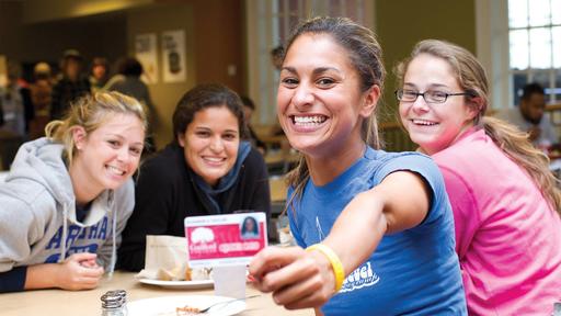 Students with their Quaker Card in the Dining Hall.