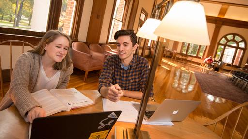 Two students study in the Carnegie Room inside Hege Library.