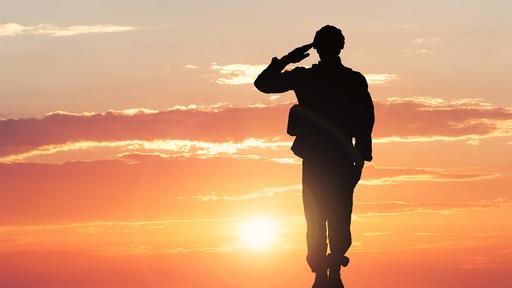 Photo of a serviceman saluting.