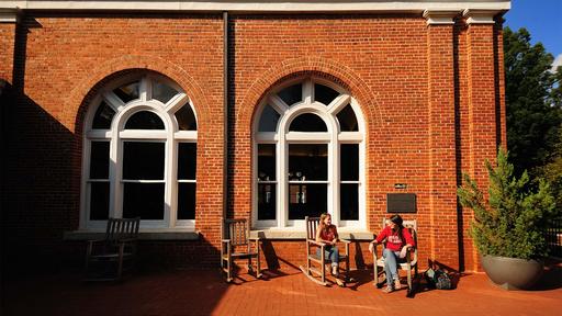 Students sit on Macon Terrace at Hege Library.