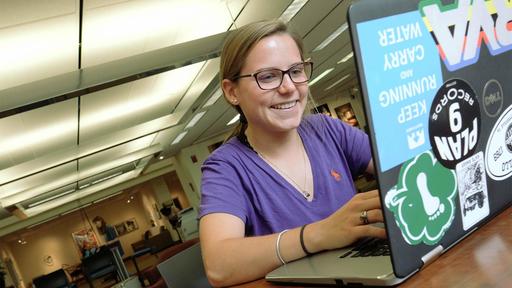A student works on her laptop in Hege Library.
