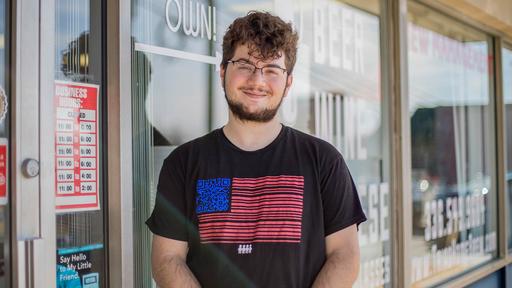 Zachary Groenberg poses for a photo outside the brewery.