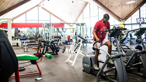 Elipticals and free weights in the pre-refreshed weight room.