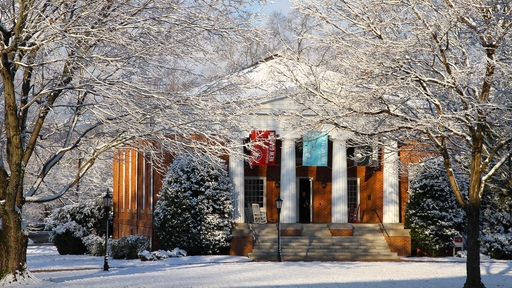 A photo of New Garden hall after a snowstorm.