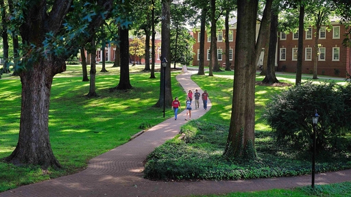 Guilford College students walk across the Quad.