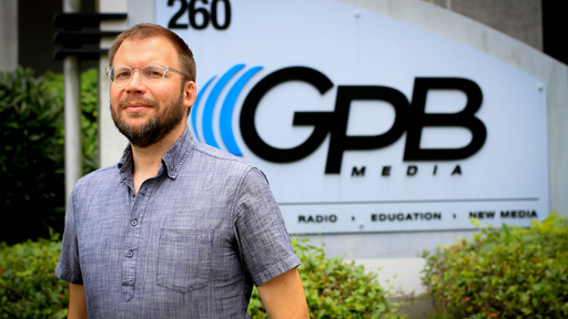 Bradley George '02 outside Georgia Public Broadcasting.