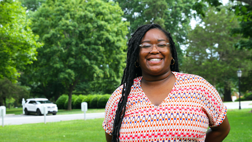 Mikisha Davis stand outdoors on campus