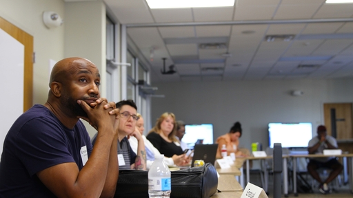 MBA students sit in the College's collaboratory during a class.