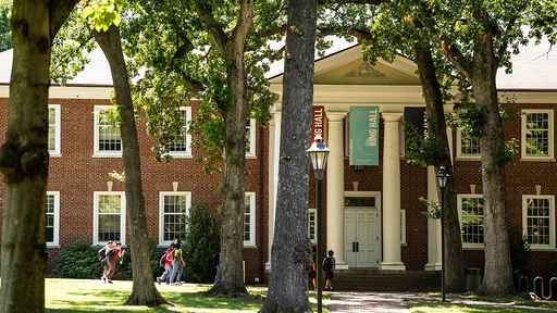 Students walk by the front of King Hall.