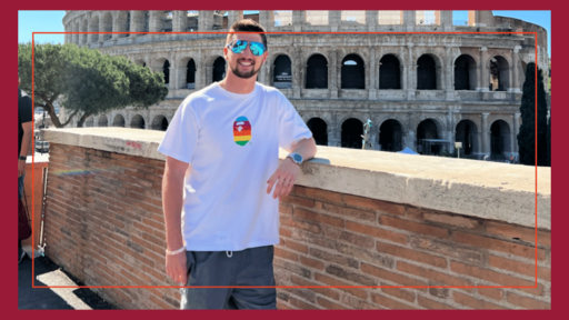 Hunter smiles in front of the Colosseum in Rome, Italy.