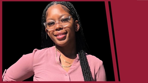 Photo of Terraia Davis wearing a pink top, clear glasses, and two necklaces