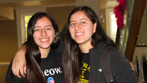 Two students (twins!) take a photo together on National First Generation College Day 2022.