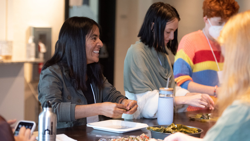 Participants at the 2023 ECAR Conference at Guilford College work on a project together to paint ceramic plates.