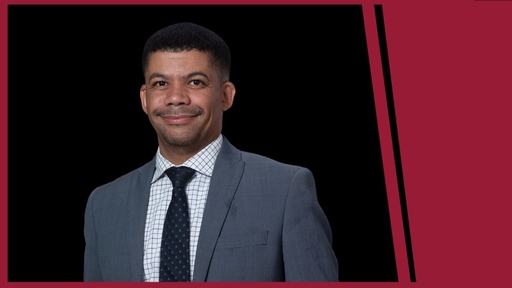 Sedwyn Anthony in a grey suit