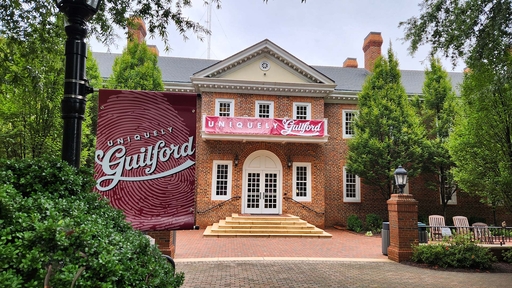 Guilford College Founders Hall with Uniquely Guilford Banners