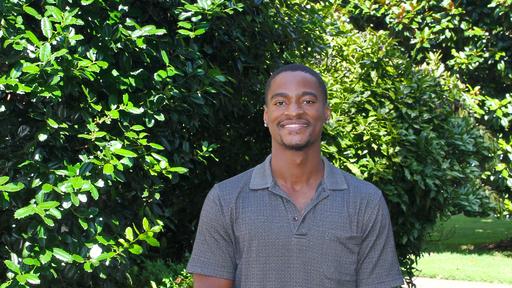 Dawson Edwards in a gray polo outside New Garden Hall