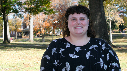 Shyla Butler on the Quad in the fall, wearing a black shirt