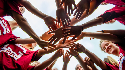 All hands in - Women's soccer rallys team spirit