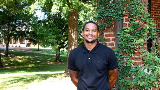 Trent Torain stands next to the gazebo in the College Quad