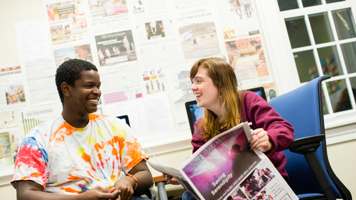 Students read the Guilfordian in the newspaper publication suite on campus.