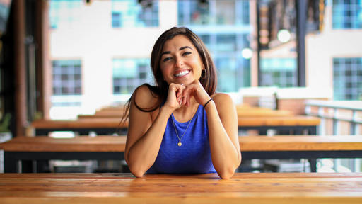 Alumna Adriana Ortiz '12 poses for a portrait in Atlanta.