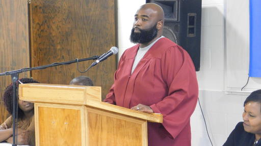 A student speaks at a Guilford College Wiser Justice prison program graduation ceremony.