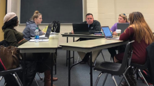 Students sit together in a master's class.