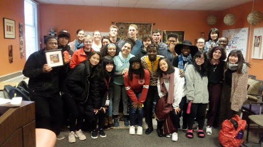 International student Samuel Odei poses for a group photo with his fellow Guilfordians.