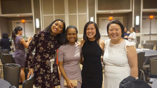 In this photo, H'lois Mlo '18 is joined by friends at a banquet.